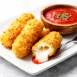 crispy baked mozzarella sticks - featured image