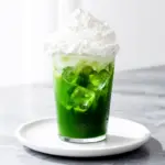 iced matcha latte with vanilla cream - featured image