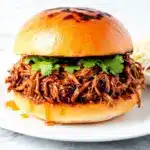 slow cooker honey garlic pulled pork sandwiches - featured image